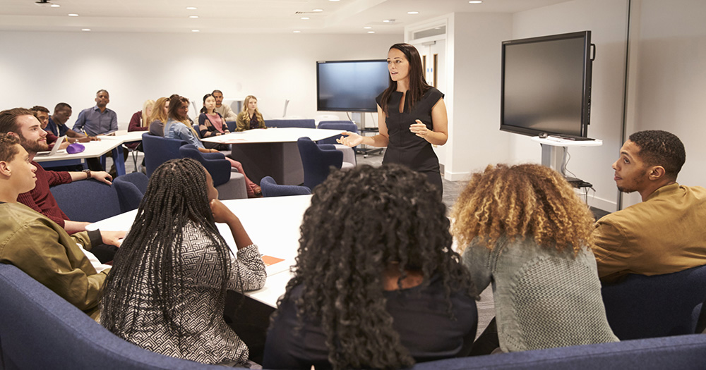 Speech teacher speaking to a classroom of students